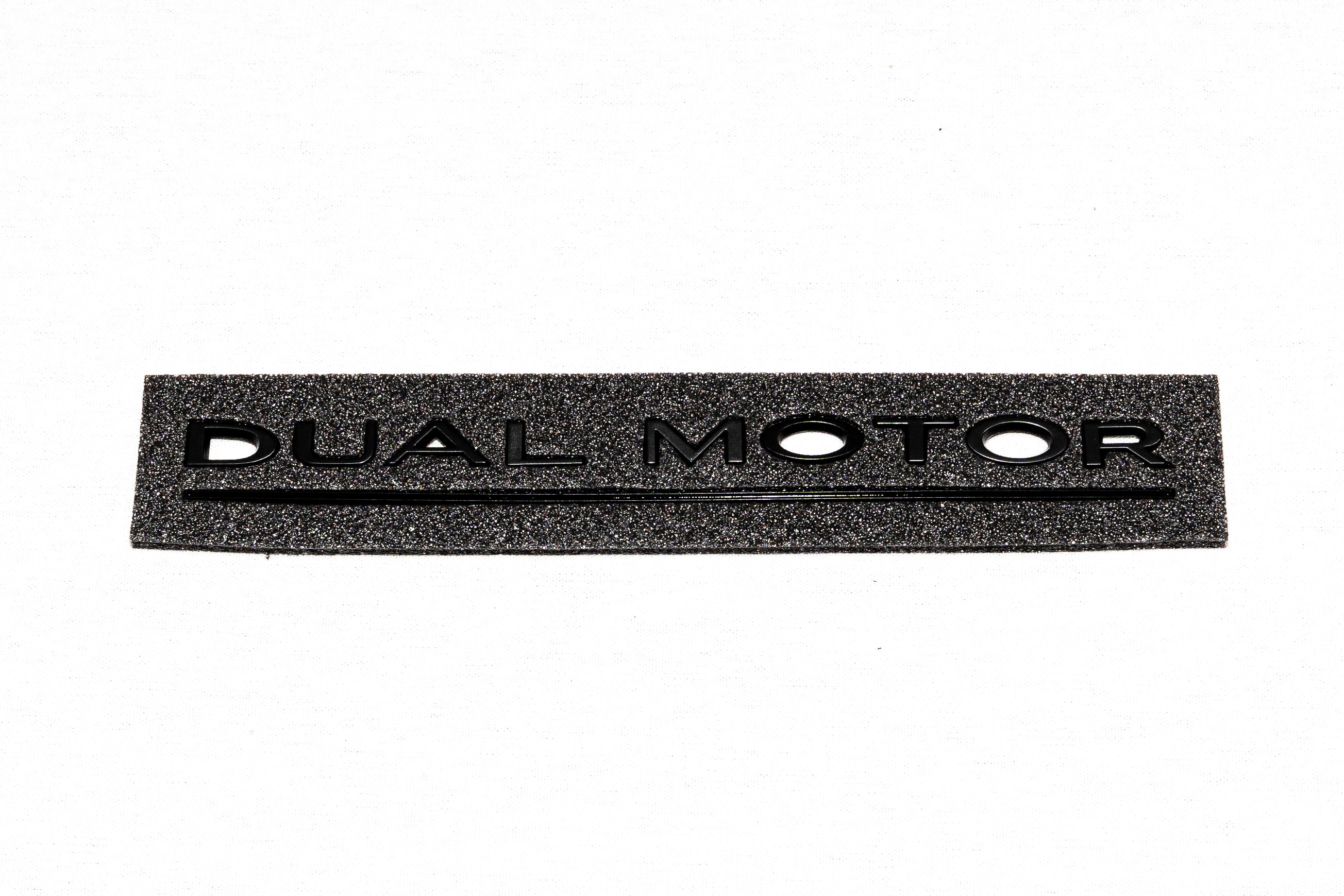 Baklucka DUAL MOTOR -etikett