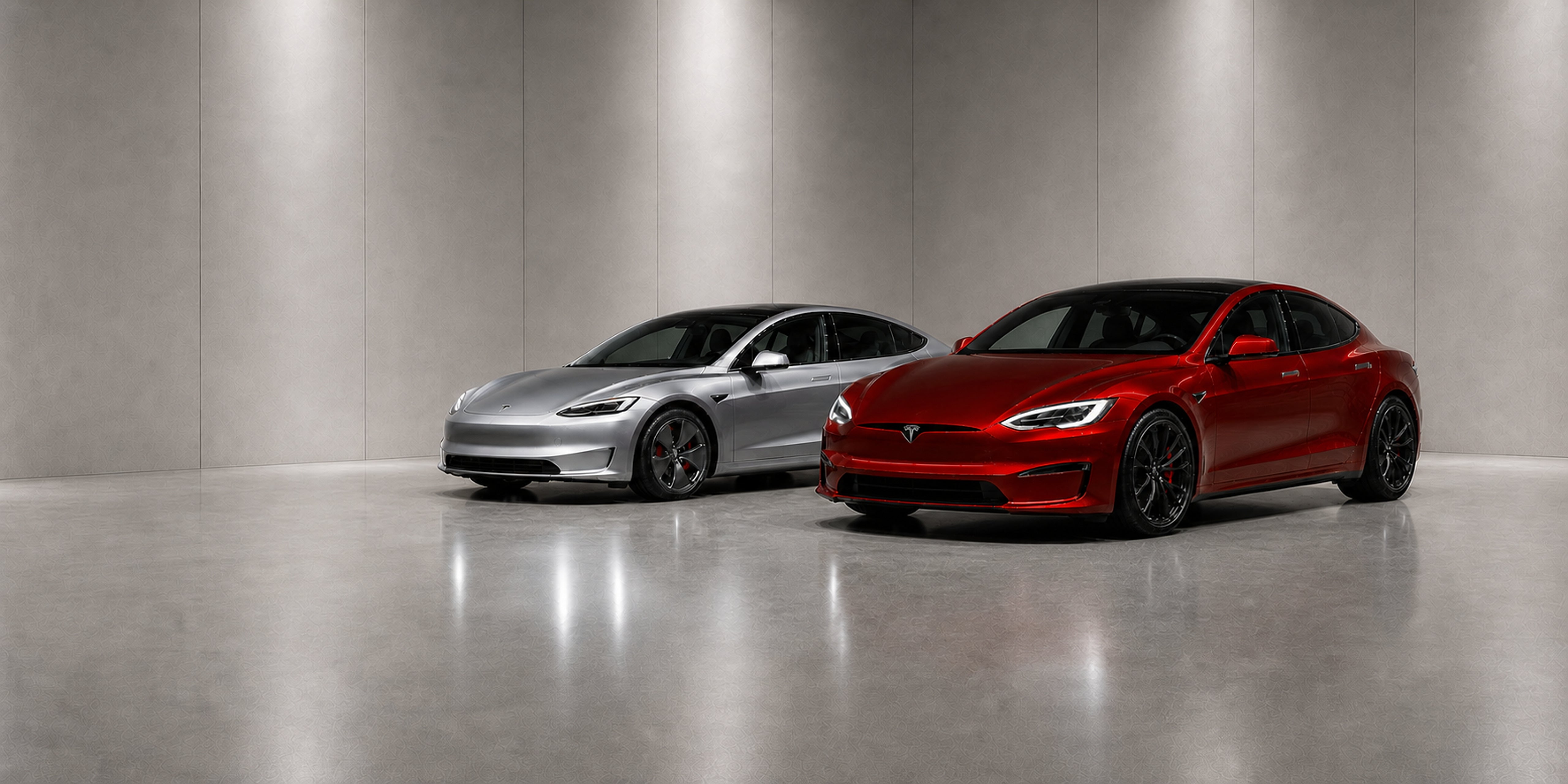 Dark red Tesla Model S Performance and a grey new-generation Tesla Model 3 Highland in a bright modern setting